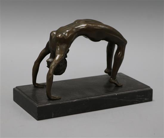 A bronze figure of an acrobat, signed Milo length 25cm